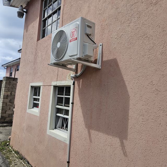 Outdoor condenser on a wall