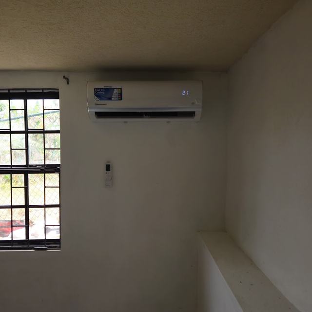 Indoor unit in a room with louvre windows